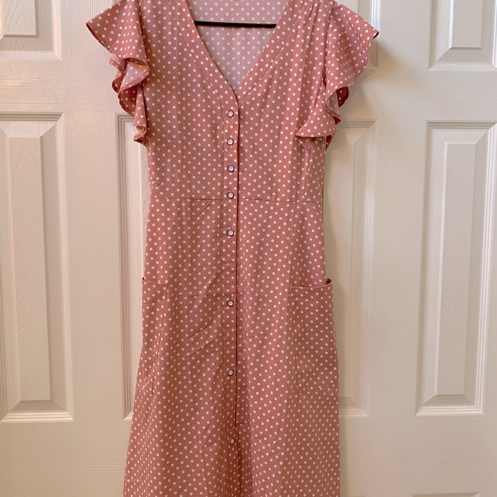 Rose pink polka dotted retro below the knee button up dress.